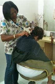 Nora Williams works her beauty magic on a customer (photo by Alexa Percell).